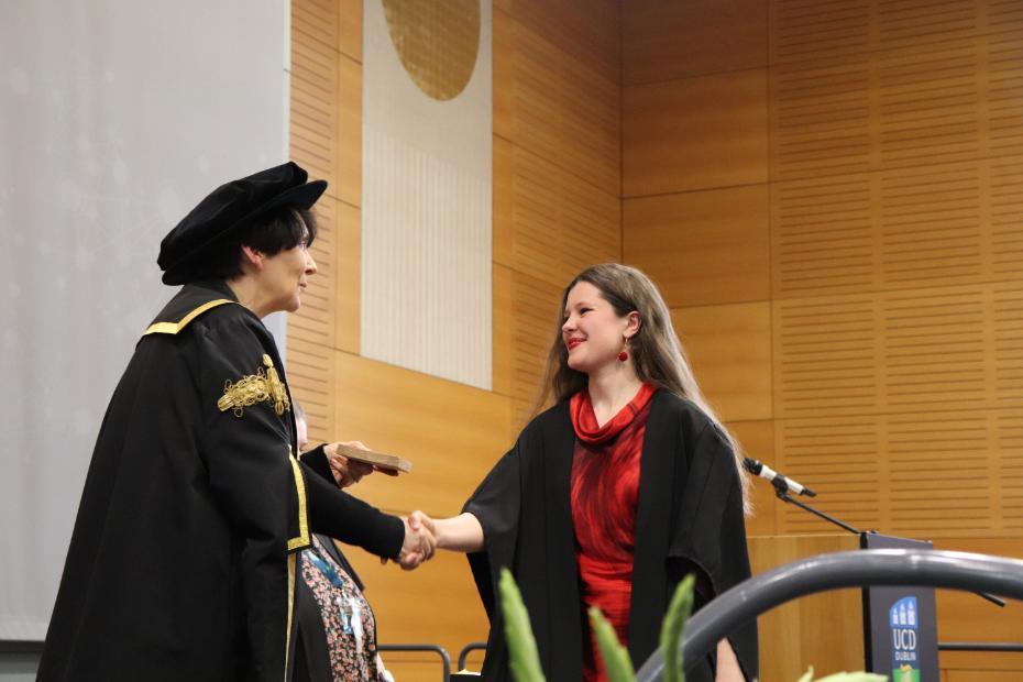 Faith Molloy receiving her award from UCD President Professor Orla Feely